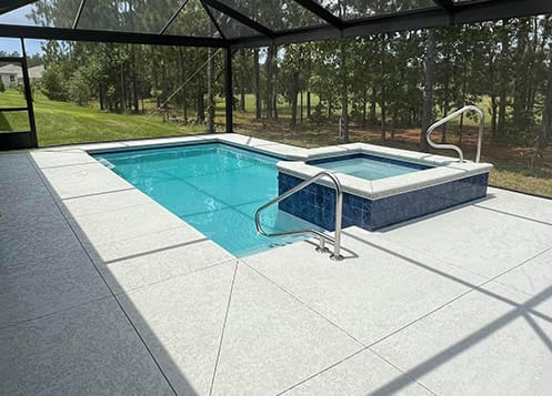 swimming pool with hot tub attached