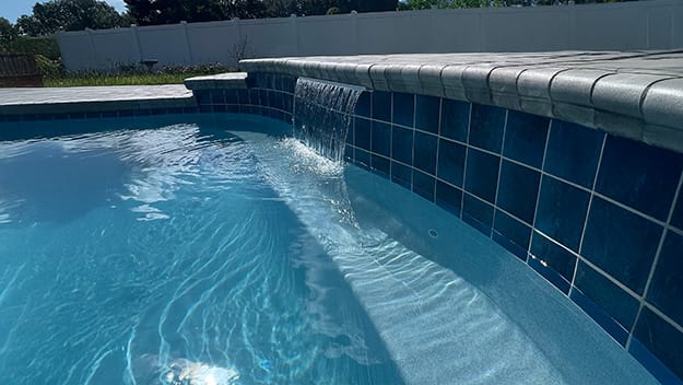 waterfall feature inside a swimming pool